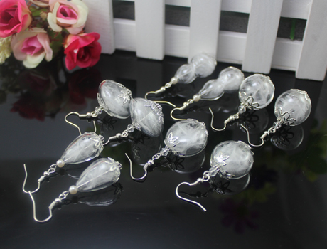 Glass globe Feather earrings